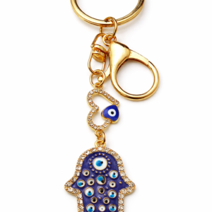 Elegant gold-tone Hamsa hand keychain with multiple Evil Eye accents — a symbolic charm accessory for positivity and style.